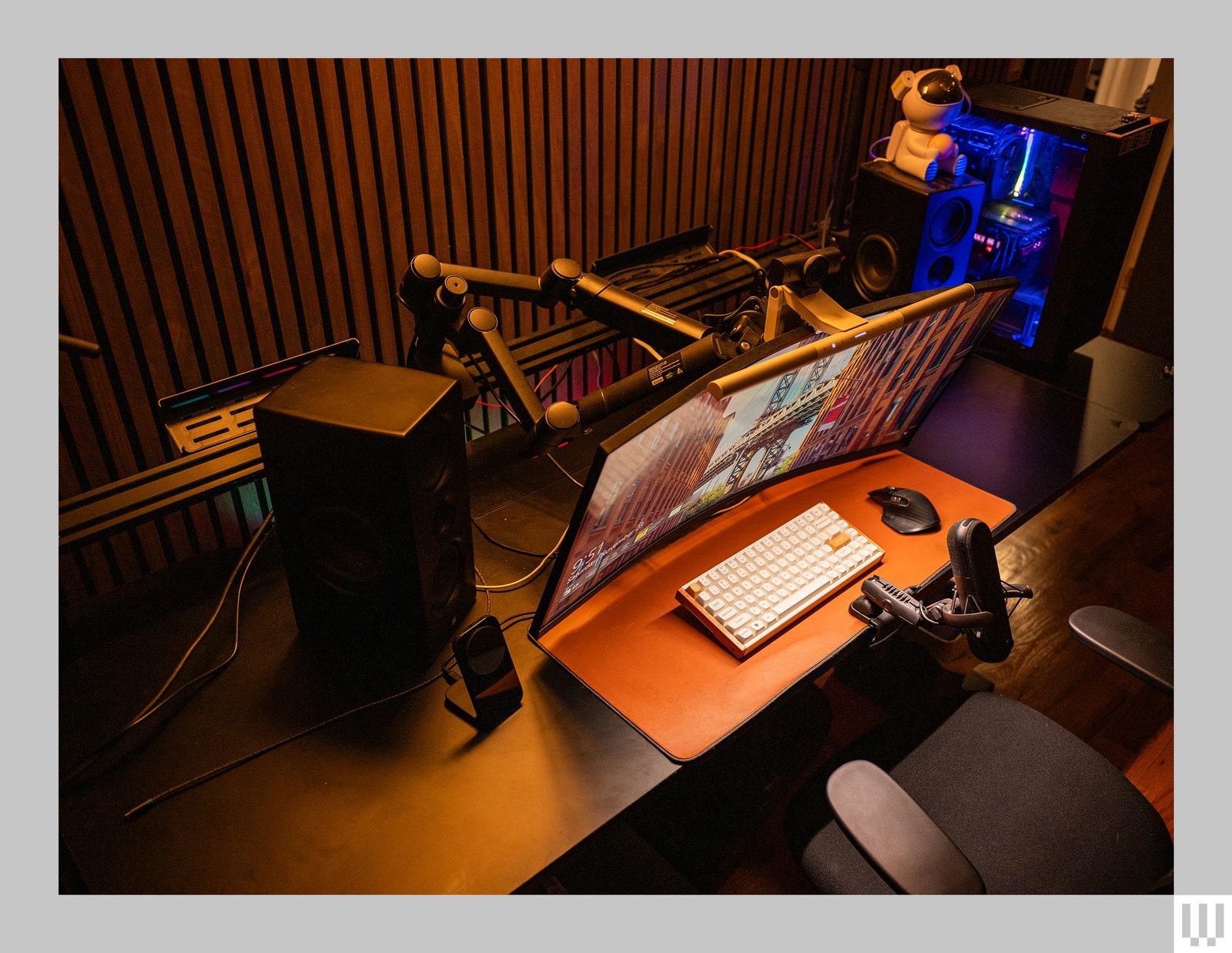 Corsair Platform 6 Desk with a black top and the railing to hold two monitors broken causing the monitor to lean forward