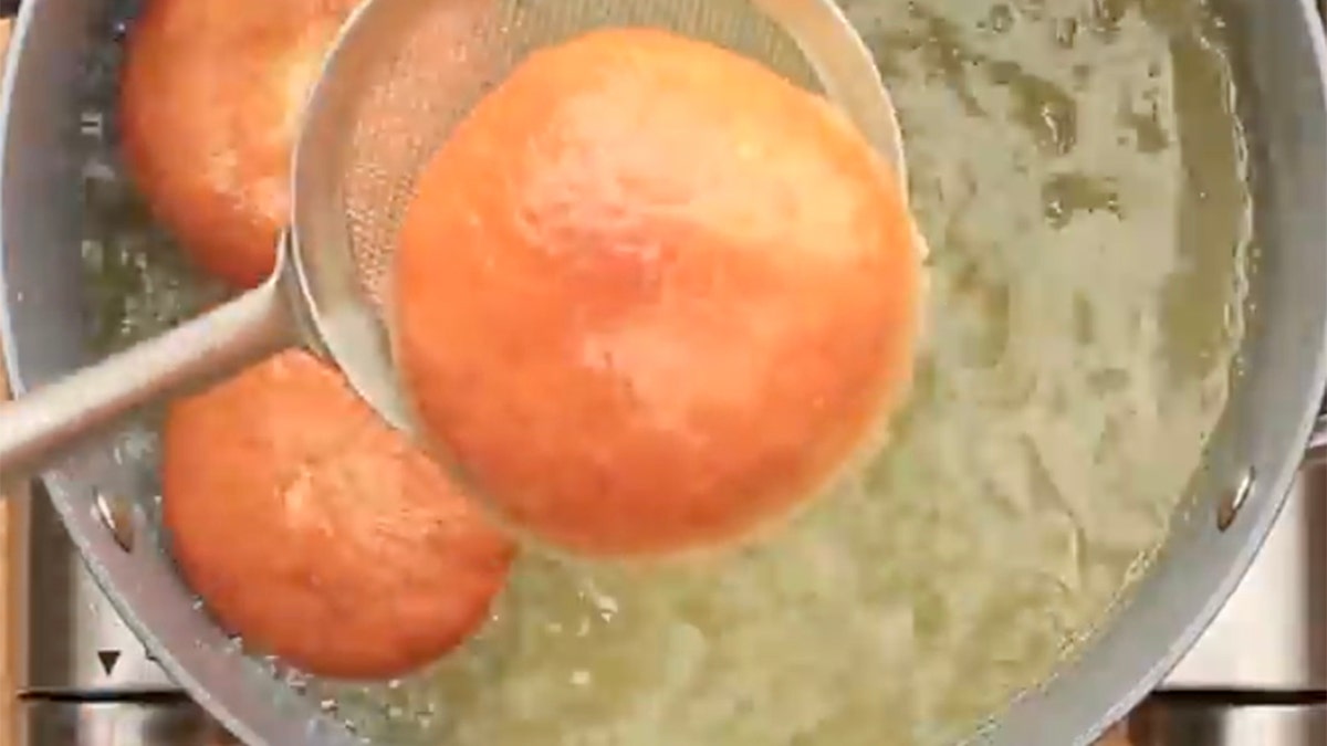 Sufganiyot being fried.