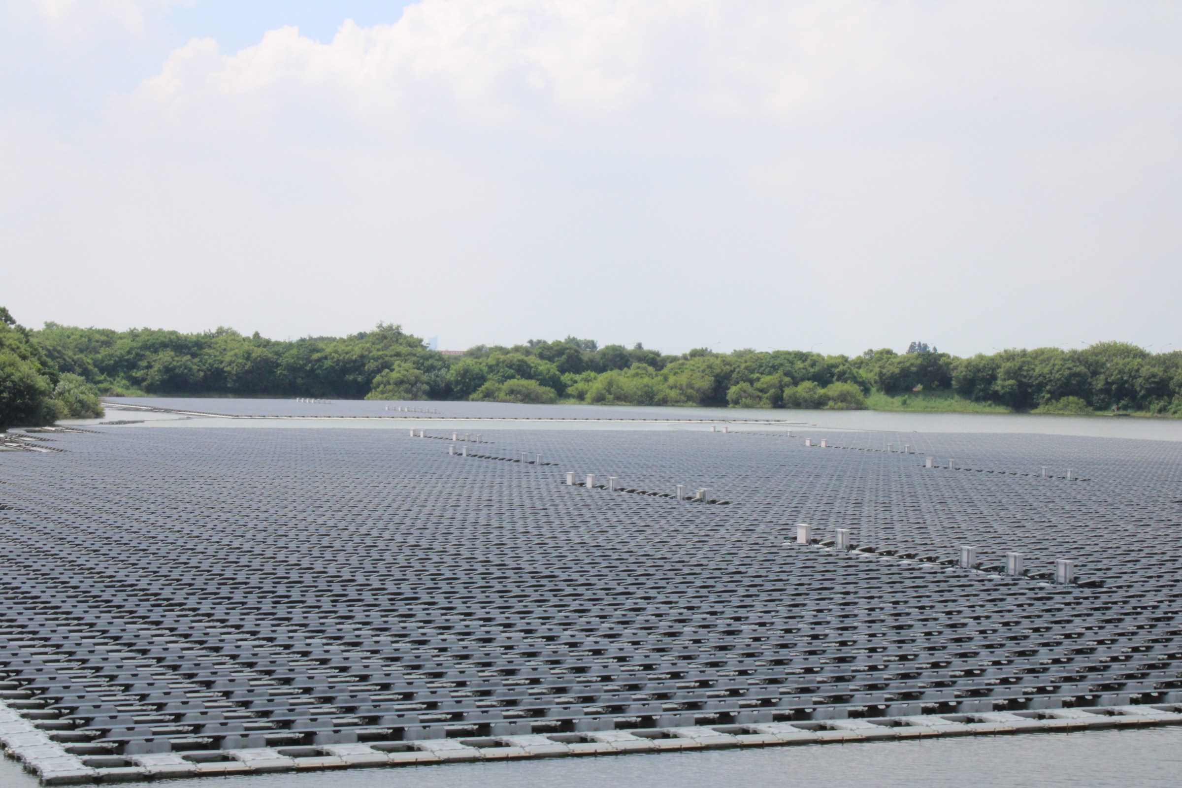 Floating solar panels and a pond.