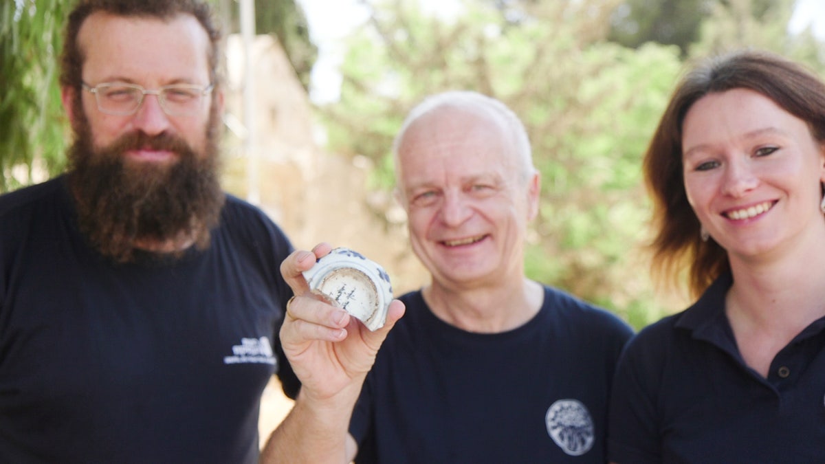 Smiling man holding bowl