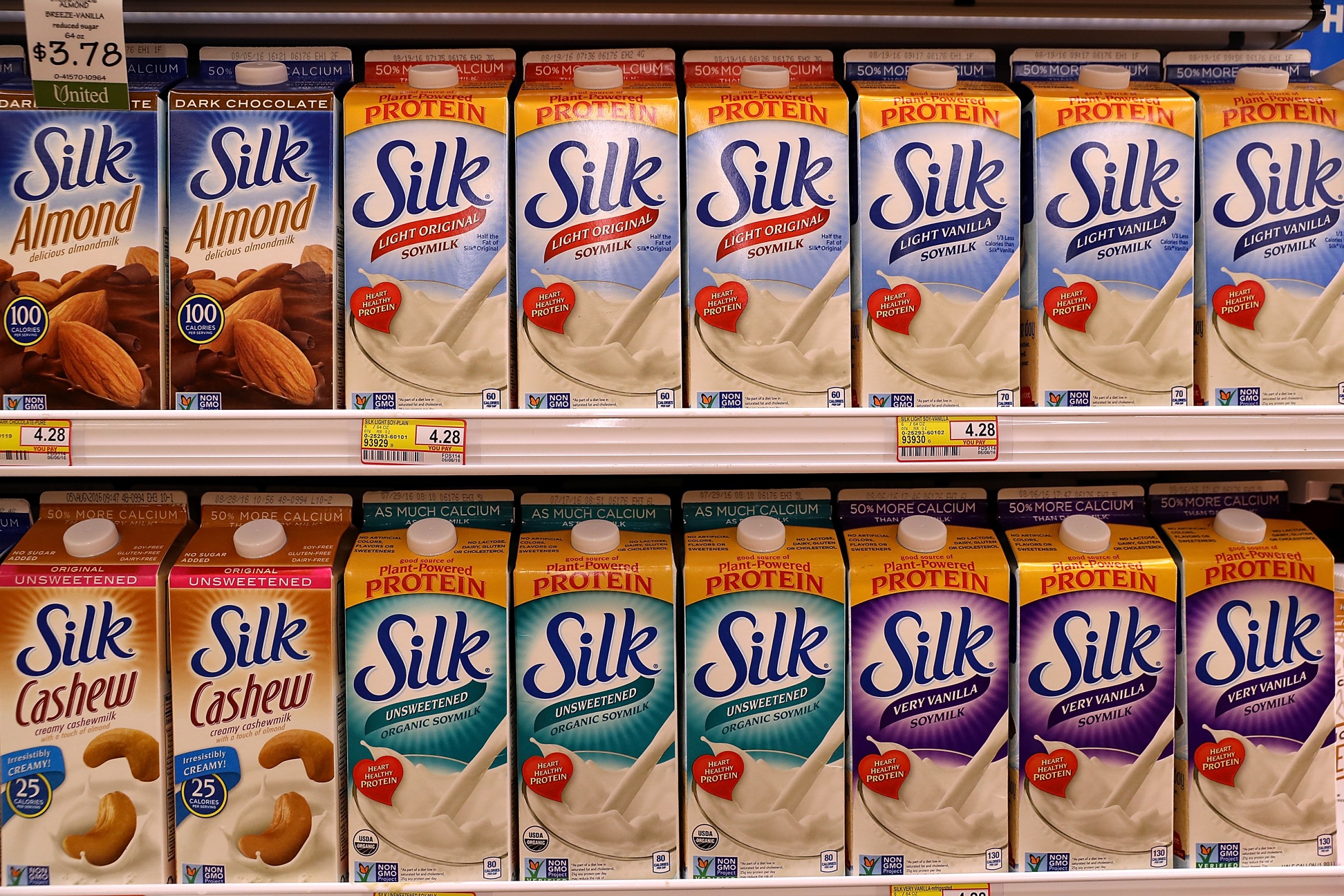 Rows of different varieties of Silk soy milk at a grocery store