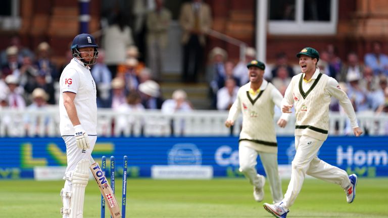 England's Jonny Bairstow (left) looks frustrated after being run out by Australia's Alex Carey (not pictured) as players celebrate during day five of the second Ashes test match at Lord's, London