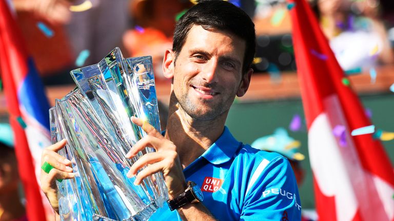 Novak Djokovic (SRB) poses with the trophy after defeating Milos Raonic (CAN) in the men's singles final at the BNP Paribas Open played at the Indian Wells Tennis Garden, Indian Wells, CA (Photo by Cynthia Lum/Icon Sportswire) (Icon Sportswire via AP Images)