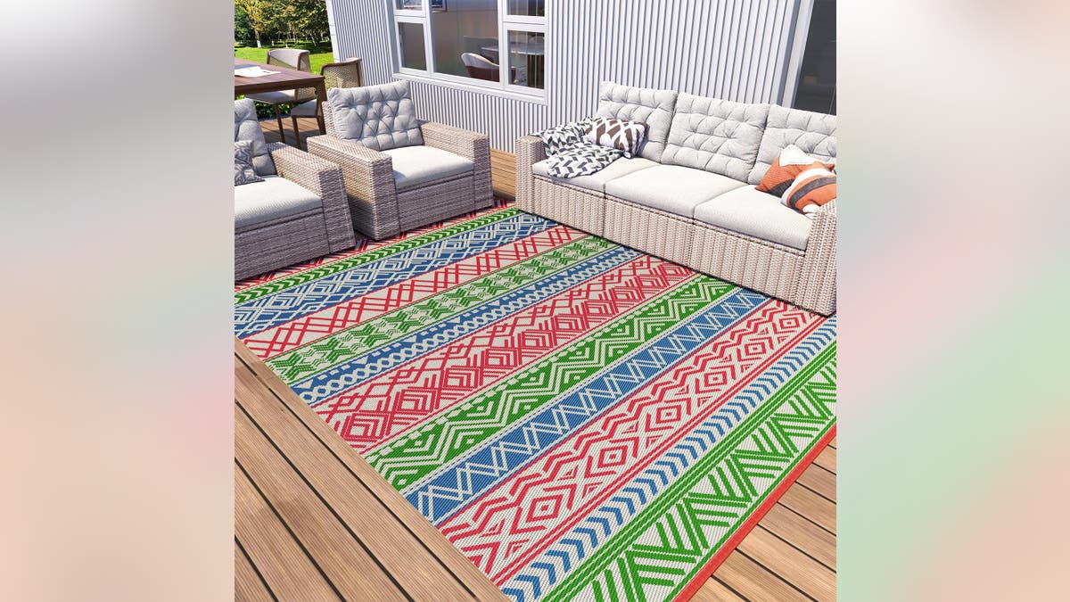 Create a beautiful patio area with this reversible rug. 