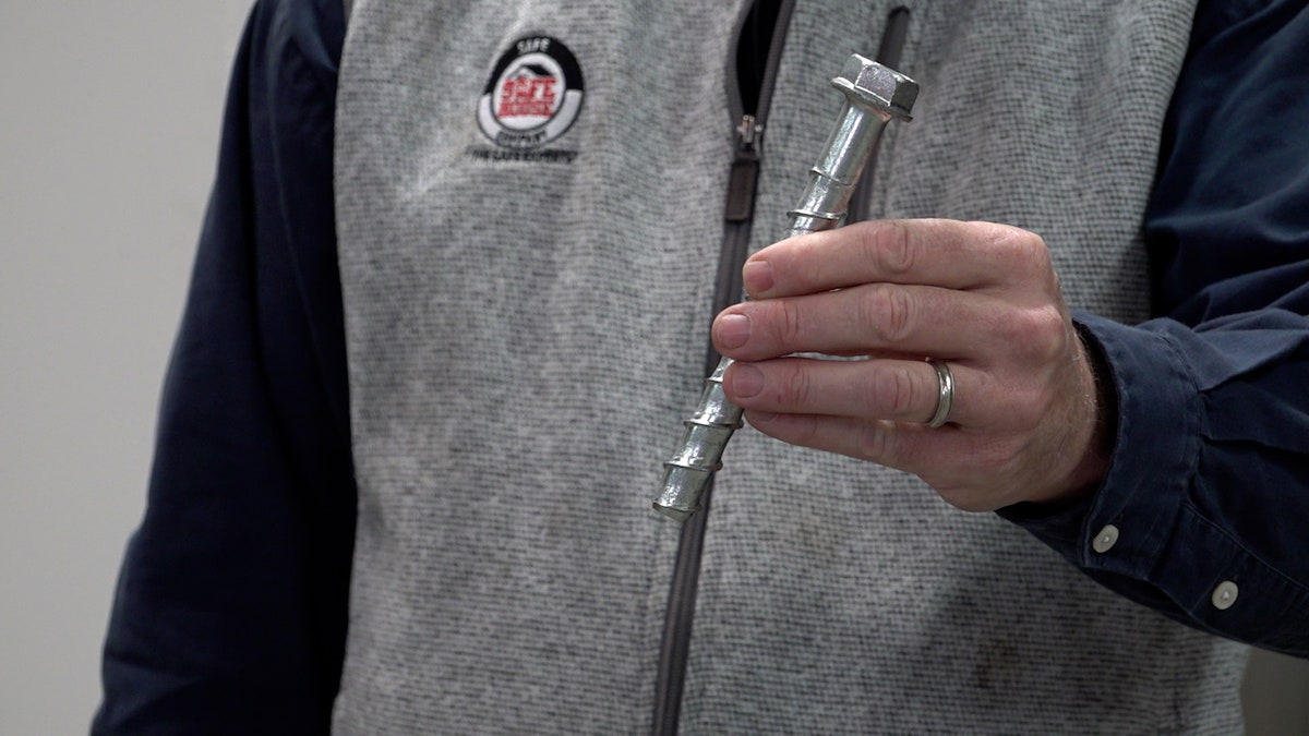 One of a dozen bolts required to help storm shelter withstand EF-5 winds.