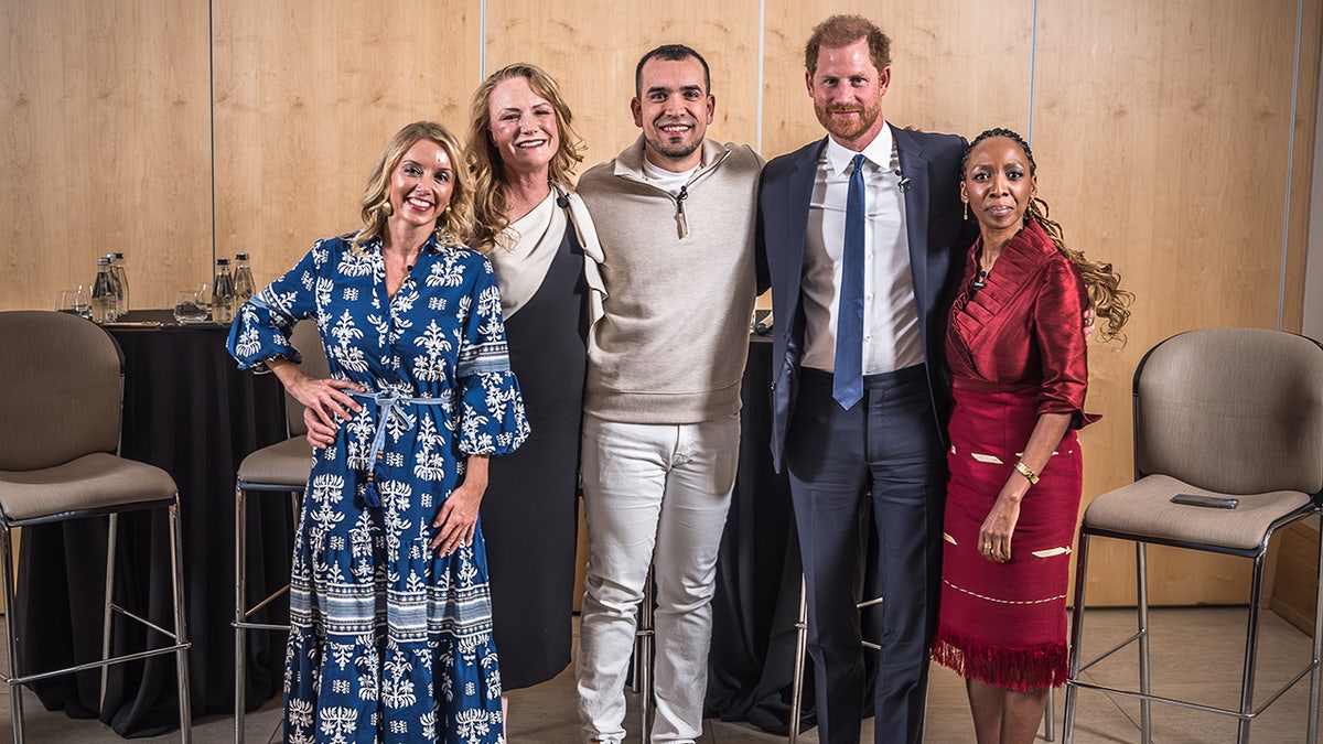 Price Harry with charity heads