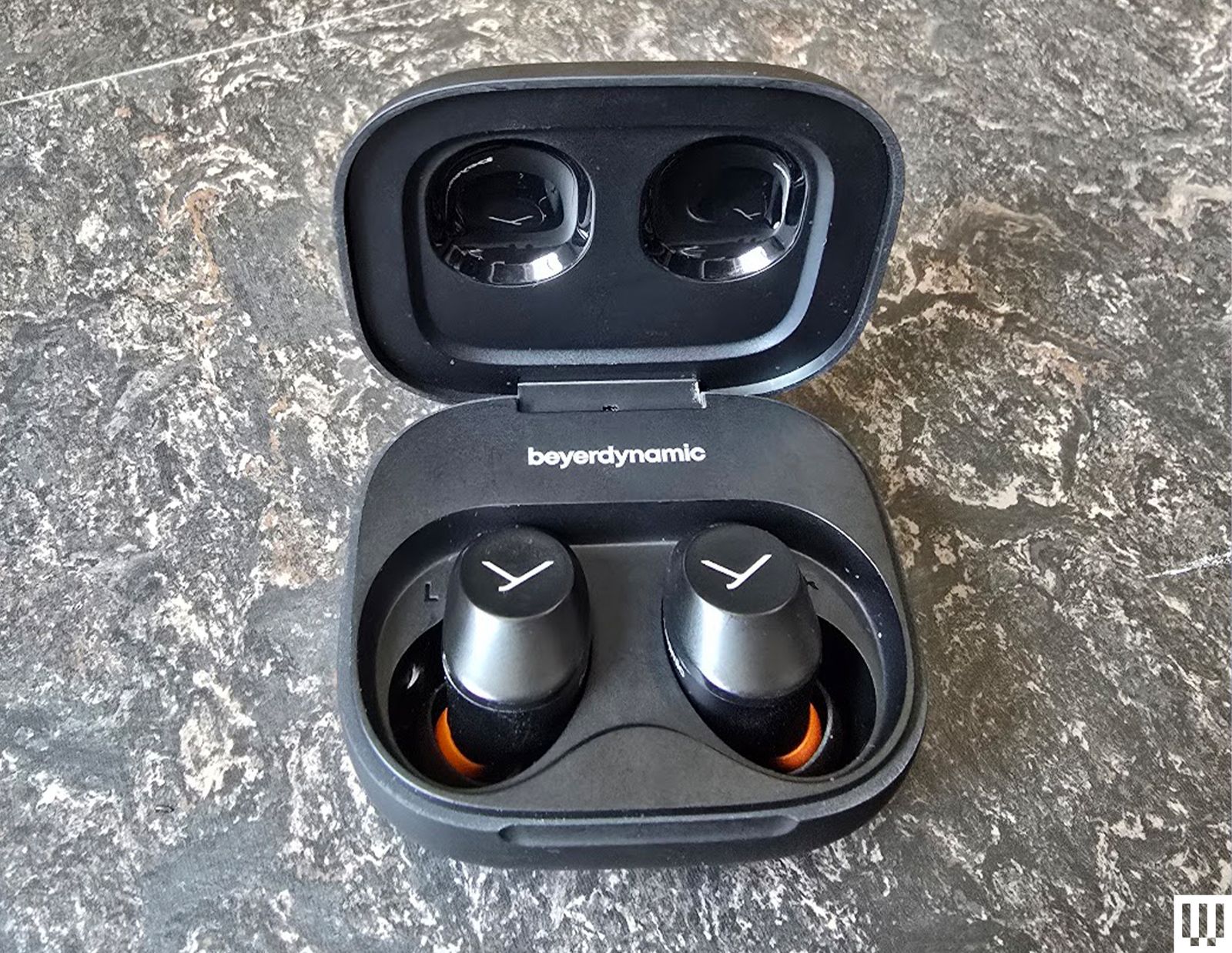 Beyerdynamic Amiron open with earbud in case on marble table