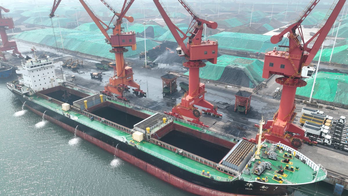 Coal is unloaded from a ship at the port in Lianyungang, in China's eastern Jiangsu province, on July 12, 2023.