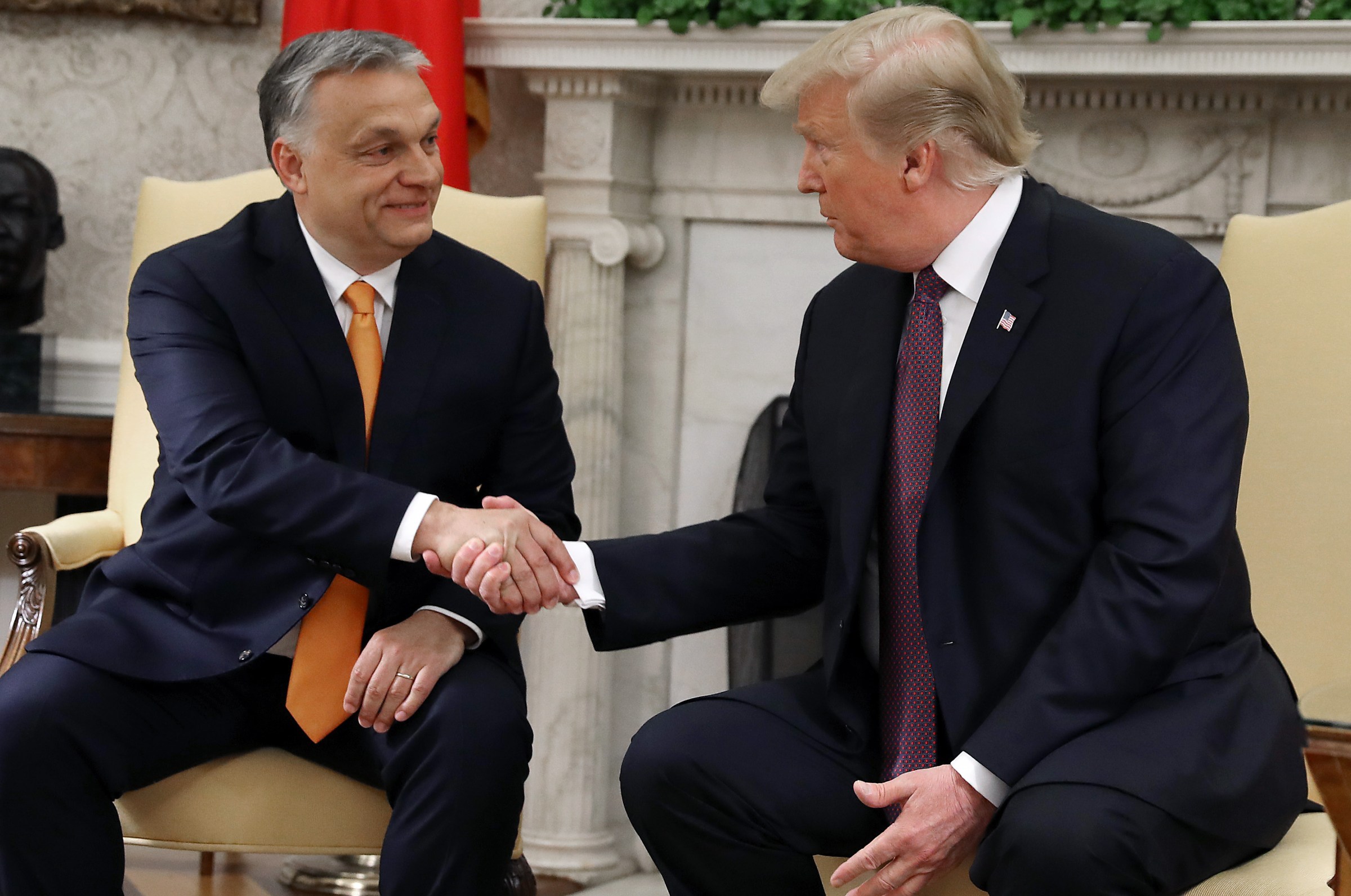 Trump shaking hands with Orban