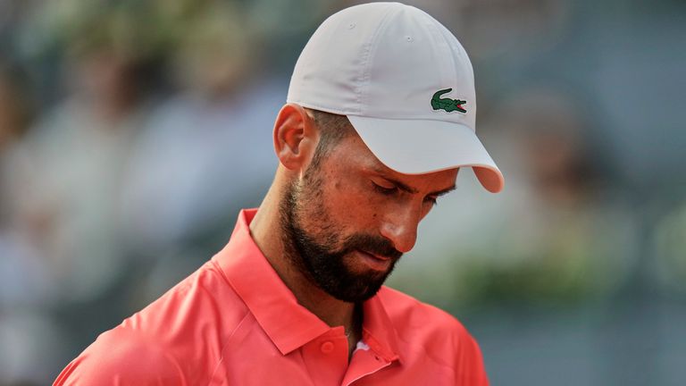 Novak Djokovic of Serbia reacts during his match against Matteo Arnaldi of Italy during the Madrid Open tennis tournament in Madrid, Spain, Saturday, April 26, 2025. (AP Photo/Manu Fernandez)