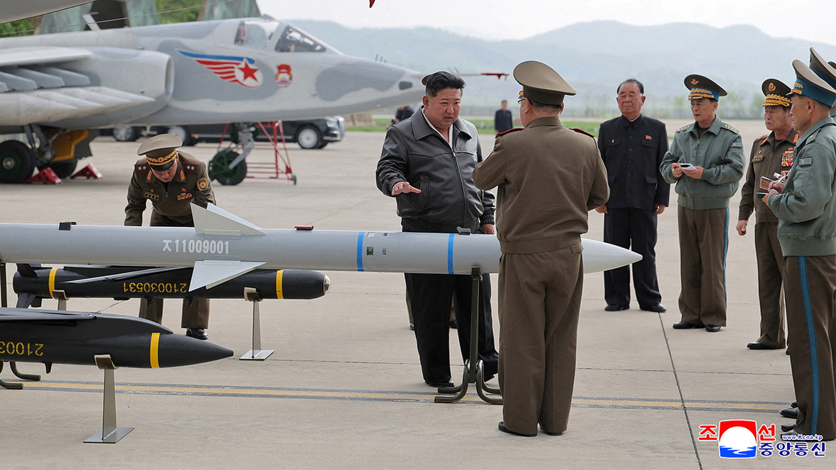 Kim Jong Un talks to military members