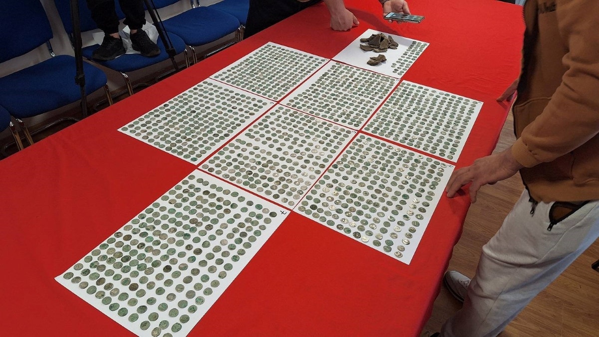 Thousands of coins on table