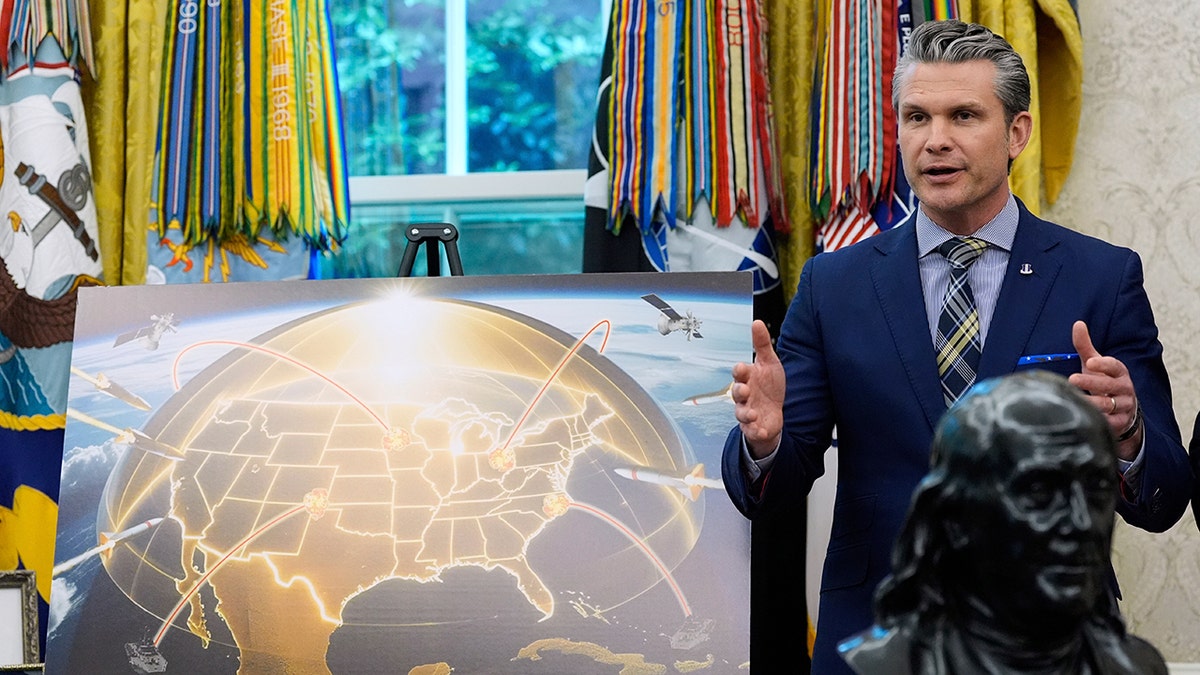 Defense Secretary Pete Hegseth speaks over Golden Dome display