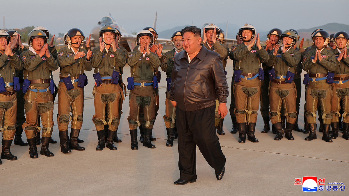 Kim Jong Un is cheered by military pilots