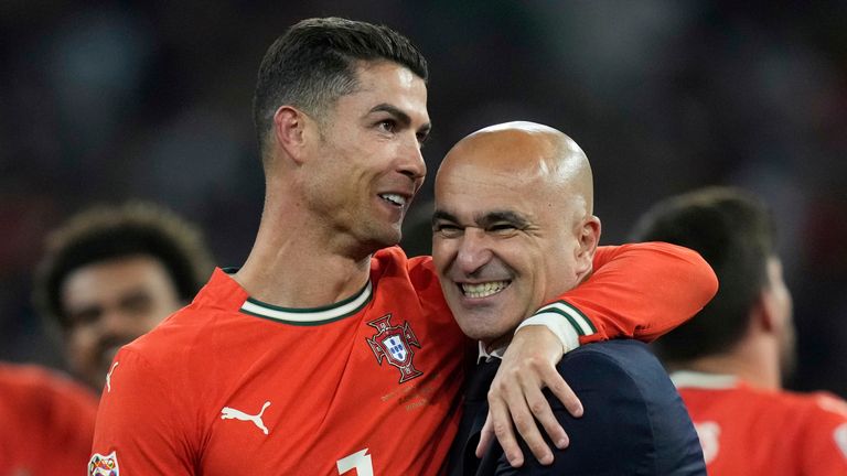 Portugal's Cristiano Ronaldo celebrates with coach Roberto Martinez 