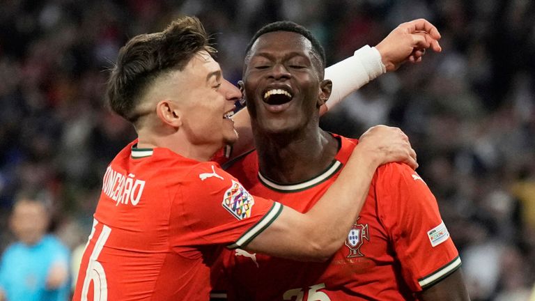 Portugal's Nuno Mendes celebrates with Francisco Conceicao after scoring against Spain