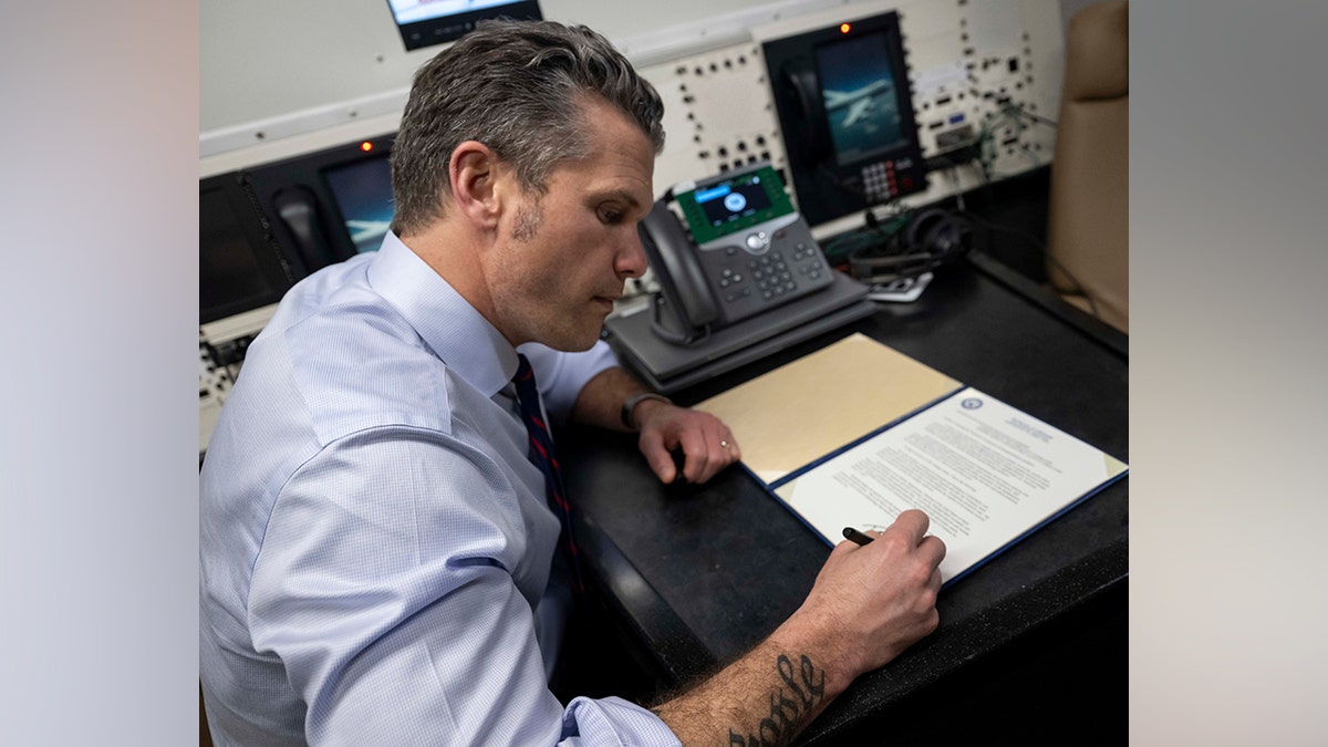 Hegseth Signs Memorandum Aboard E-4B