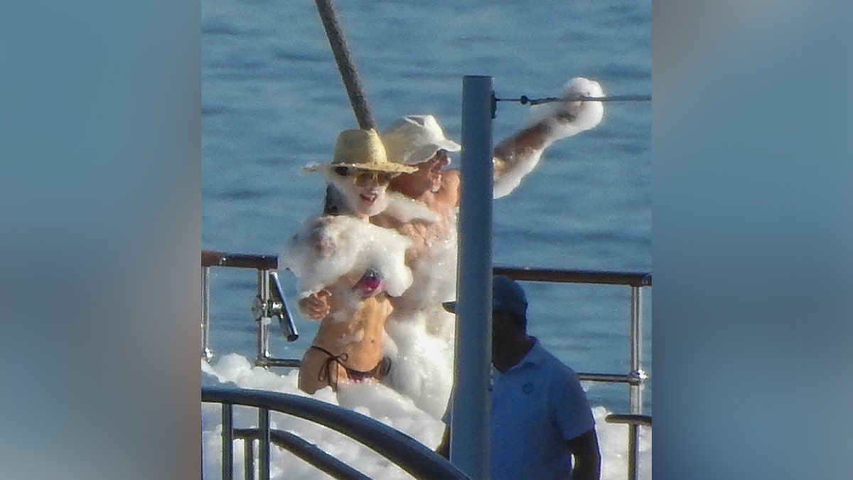 Jeff Bezos and Lauren Sanchez with their arms around each other while on a yacht off the coast of Croatia.