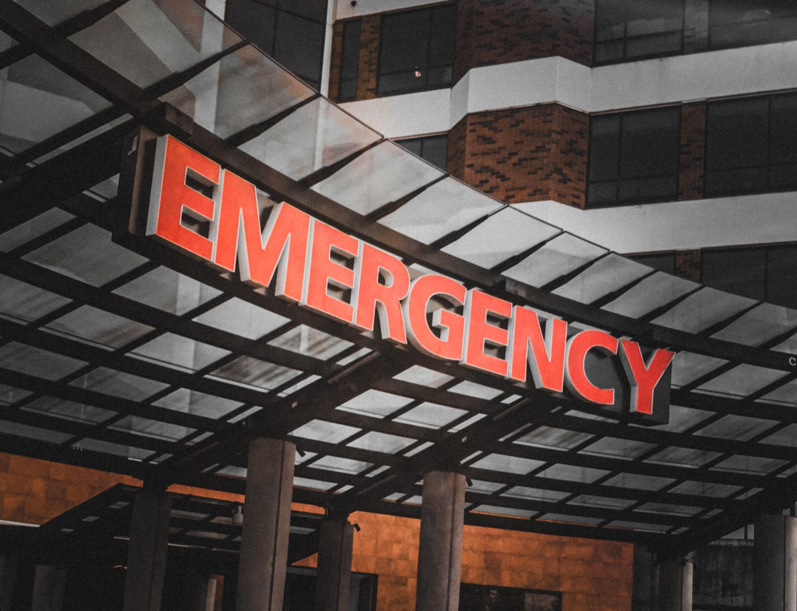 Exterior photo of an EMERGENCY sign at a hospital emergency room