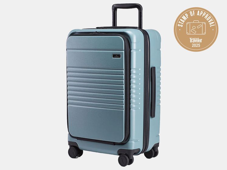 light blue and black rolling suitcase