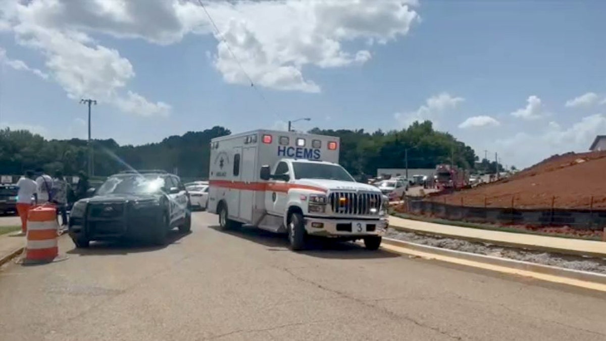 Ambulance driving at scene of shooting