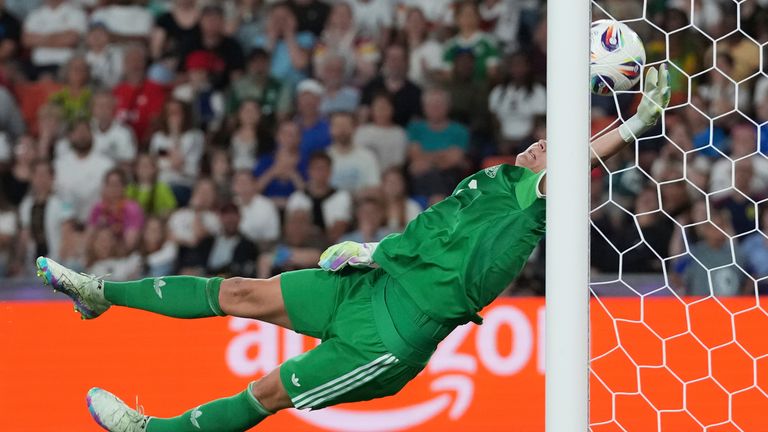 Germany goalkeeper Ann-Katrin Berger makes a save during the Women's Euro 2025 quarterfinals soccer match between France and Germany at St. Jakob-Park in Basel, Switzerland, Saturday, July 19, 2025. (AP Photo/Martin Meissner)