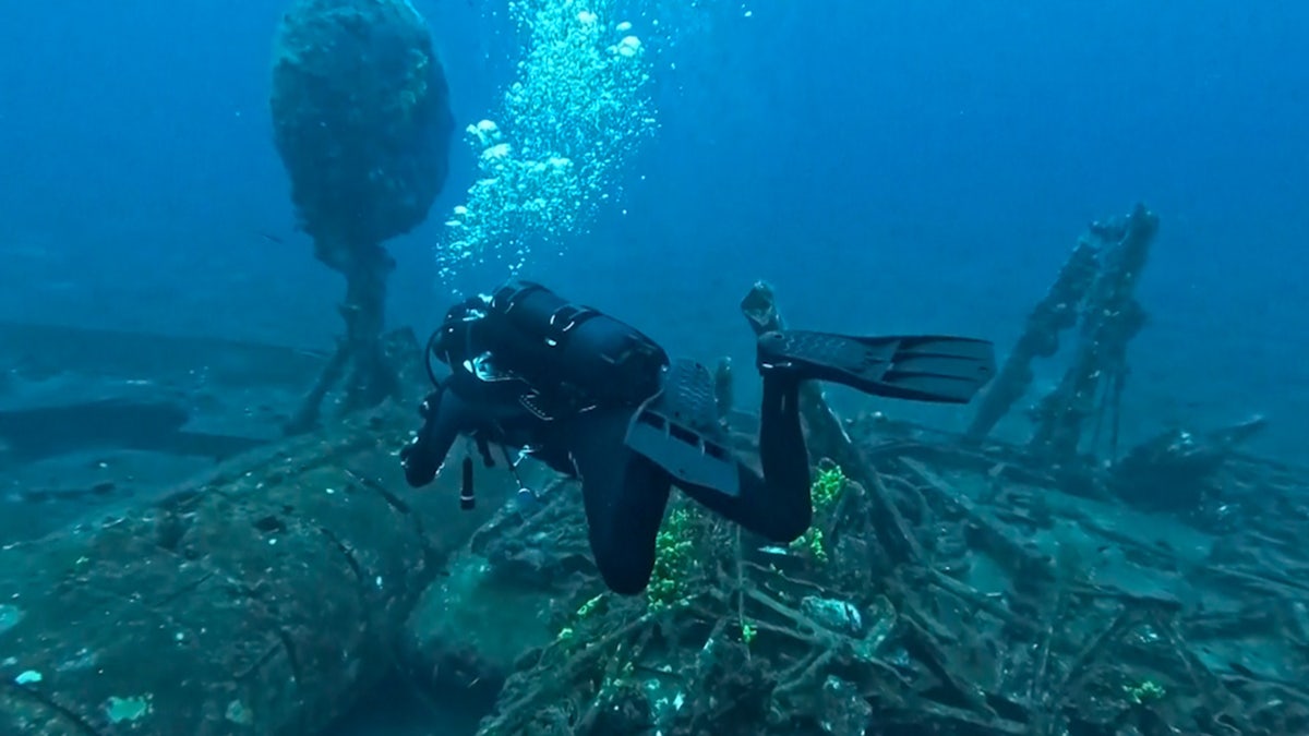 Diver near shipwreck site