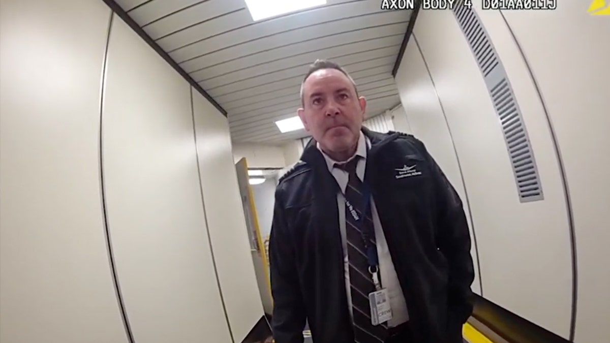 Allsop talking to police outside of plane