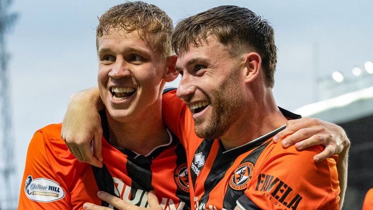 Dundee United's Zac Sapsford (left) celebrates with Ryan Strain (R) after scoring  Conference League qualifier