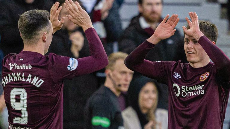 EDINBURGH, SCOTLAND - DECEMBER 22: Hearts' James Penrice (R) celebrates scoring to make it 1-0 with Lawrence Shankland during a William Hill Premiership match between Heart of Midlothian and St Johnstone at Tynecastle Park, on December 22, 2024, in Edinburgh, Scotland. (Photo by Mark Scates / SNS Group)