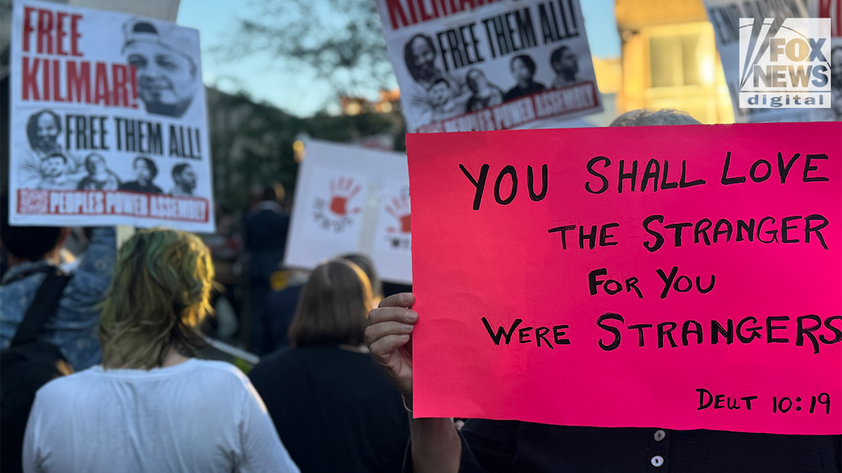 Supporters for Kilmar Abrego Garica hold up signs 