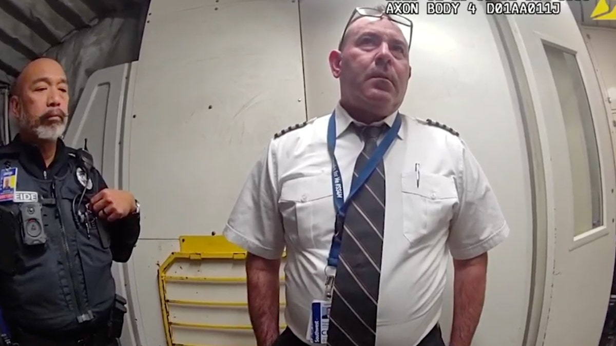 Allsop looking at officer in plane