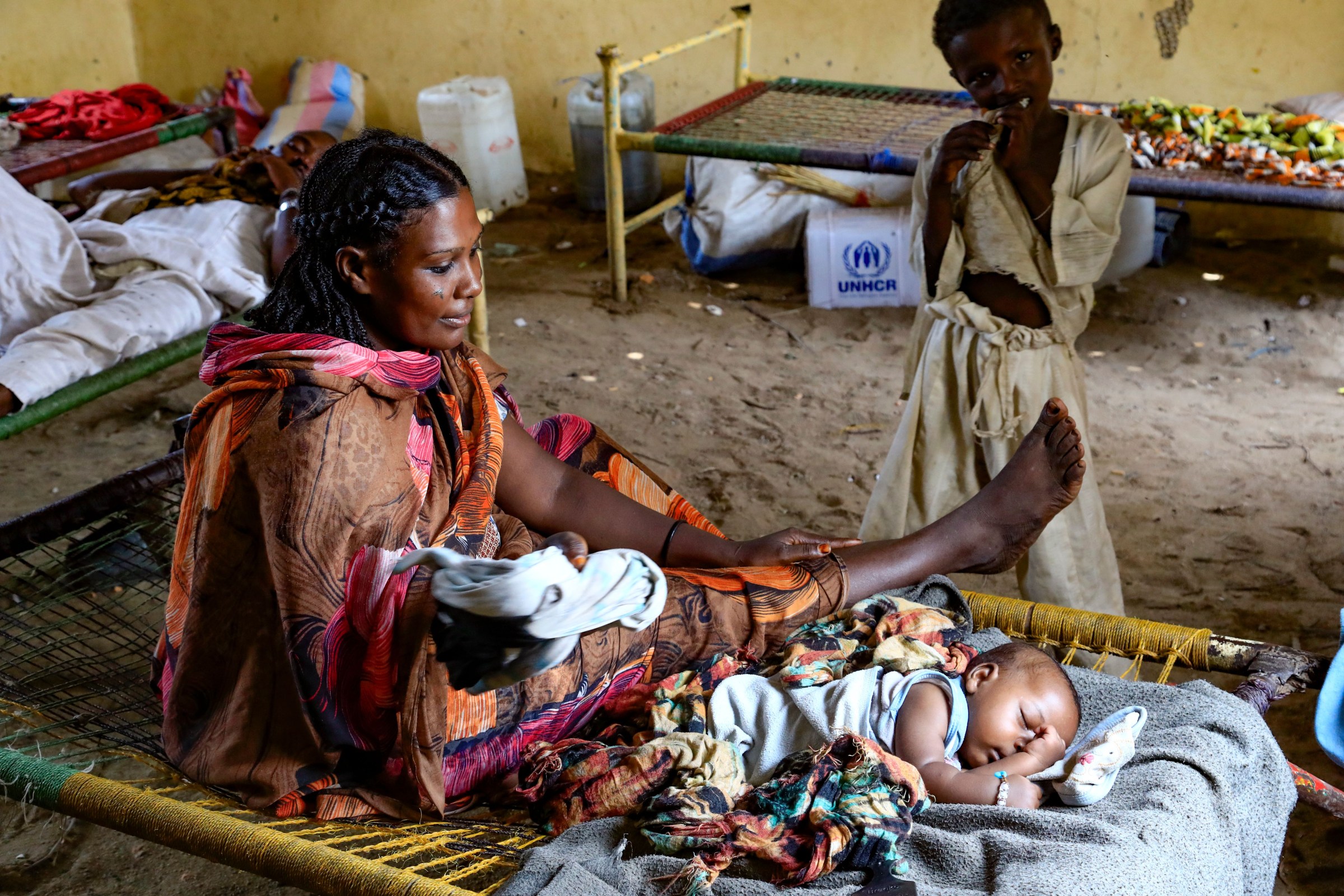 A Sudanese mother with her children at a shelter in Sudan