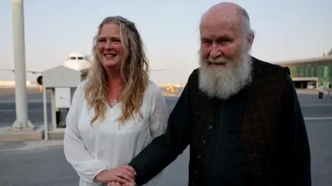 Reuters Peter Reynolds, who was released from Taliban detention in Afghanistan, walks with his daughter Sarah Entwistle 