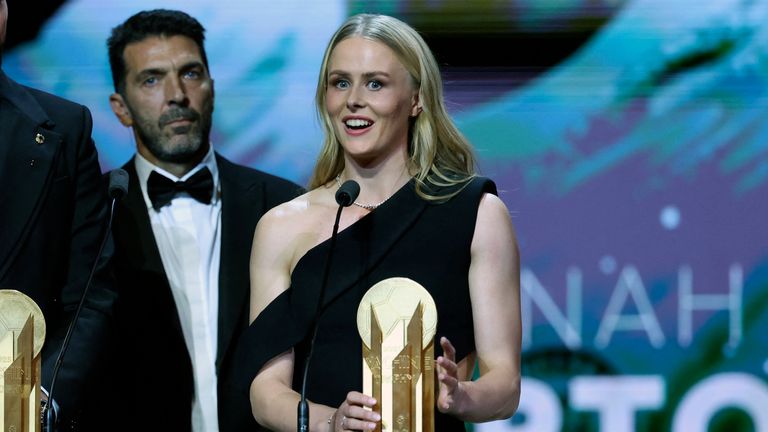 England's goalkeeper Hannah Hampton speaks next to Italy's goalkeeper Gianluigi Donnarumma (L) after they both received the Yashin Trophy for the best goalkeepers during the 2025 Ballon d'Or France Football award ceremony at the Theatre du Chatelet in Paris on September 22, 2025. (Photo by Franck FIFE / AFP)