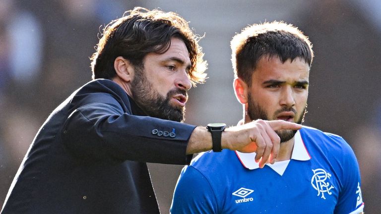 GLASGOW, SCOTLAND - AUGUST 09: Rangers' Nicolas Raskin (R) with Head Coach Russell Martin as he is substituted on during a William Hill Premiership match between Rangers and Dundee at Ibrox Stadium, on August 09, 2025, in Glasgow, Scotland. (Photo by Rob Casey / SNS Group)