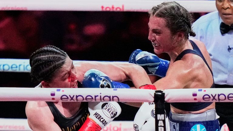 England's Ellie Scotney, left, punches Mexico's Yamileth Mercado during the eighth round of a super bantamweight boxing match Friday, July 11, 2025, in New York. (AP Photo/Frank Franklin II)