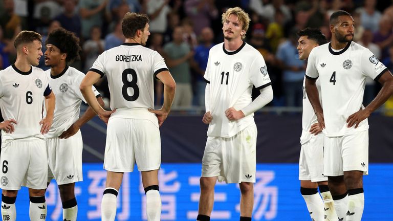Germany players react after losing to Slovakia in their World Cup qualifier