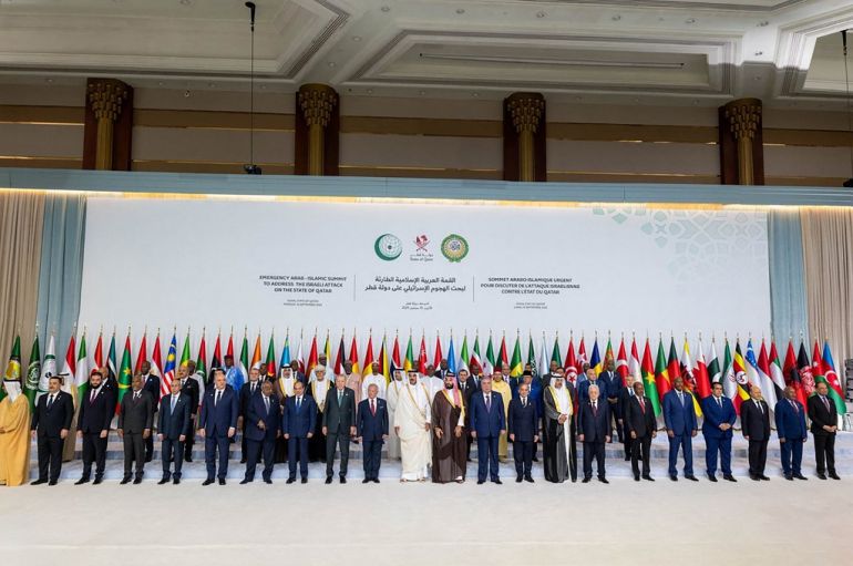 Qatar's Emir Sheikh Tamim bin Hamad Al-Thani (C) posing for a group picture with leaders, heads of state and other officials during the 2025 Arab-Islamic emergency summit in Doha on September 15, 2025. [Qatar News Agency/ AFP]