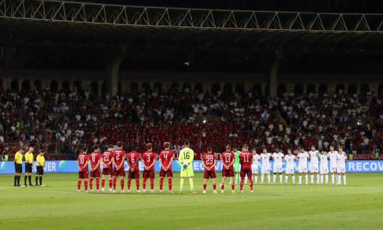 The players and officials stand for a minutes silence in tribute to Liverpool's Diogo Jota and his brother Andre Silva before the match