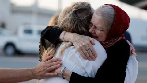 Reuters Barbie Reynolds, who was released from Taliban detention in Afghanistan, is greeted by her daughter Sarah Entwistle 