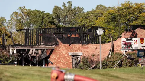 Getty Images A church in Grand Blanc burns down after an arson and shooting attack