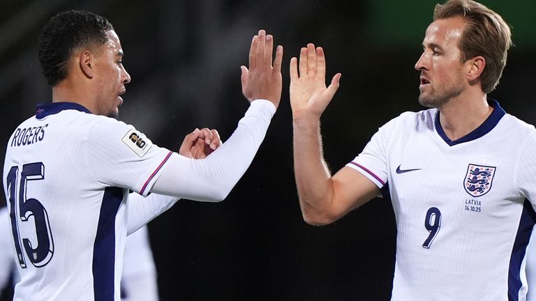 Harry Kane celebrates his first goal against Latvia with Morgan Rogers