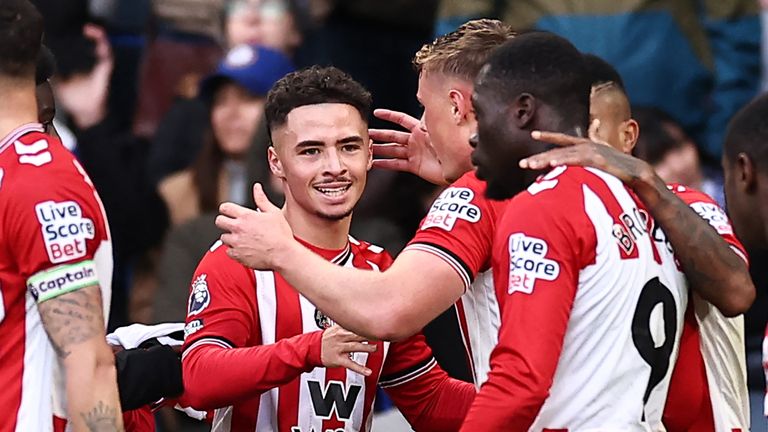Chemsdine Talbi celebrates his match-winner with team-mates