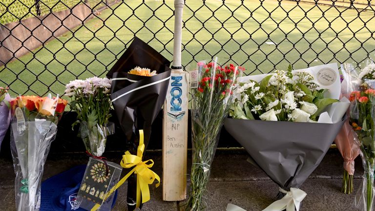 Tribute are left at cricket nets after the death of Australian cricketer Ben Austin
