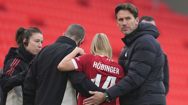 Liverpool manager Gareth Taylor consoles Marie Hobinger as she leaves the pitch with an injury