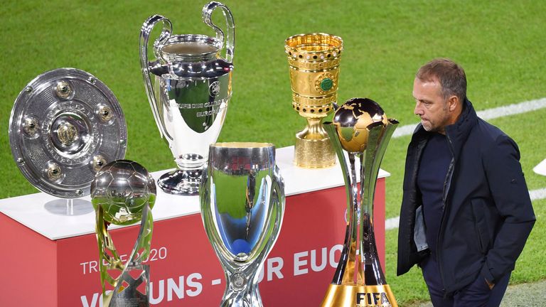 FOTOMONTAGE:.Zum Ende der Aera von Hansi Flick als Trainer von Bayern Muenchen..Archivfoto:.Das Triple-Schale,Meisterschale,Champions League Pokal und DFB Pokal werden praesentiert-Hans Dieter Flick (Hansi ,Trainer Bayern Muenchen) geht scheinbar achtlos daran vorbei..Pokal,Cup,Trophaee.Sachaufnahme..Fussball 1. Bundesliga Saison 2020/2021,1.Spieltag,Spieltag01,.FC Bayern Muenchen (M) - FCSchalke 04 (GE) 8-0,.am 18.09.2020 in Muenchen.A L L I A N Z   A R E N A,.DFL REGULATIONS PROHIBIT ANY USE OF PHOTOGRAPHS AS IMAGE SEQUENCES AND/OR QUASI-VIDEO.EDITORIAL USE ONLY....SVEN SIMON Fotoagentur GmbH & Co. Pressefoto KG # Prinzess-Luise-Str. 41 # 45479 M u e l h e i m /  R u h r # Tel. 0208/9413250 # Fax. 0208/9413260 # GLS Bank # BLZ 430 609 67 # Kto. 4030 025 100 # IBAN DE75 4306 0967 4030 0251 00 # BIC GENODEM1GLS # www.svensimon.net.