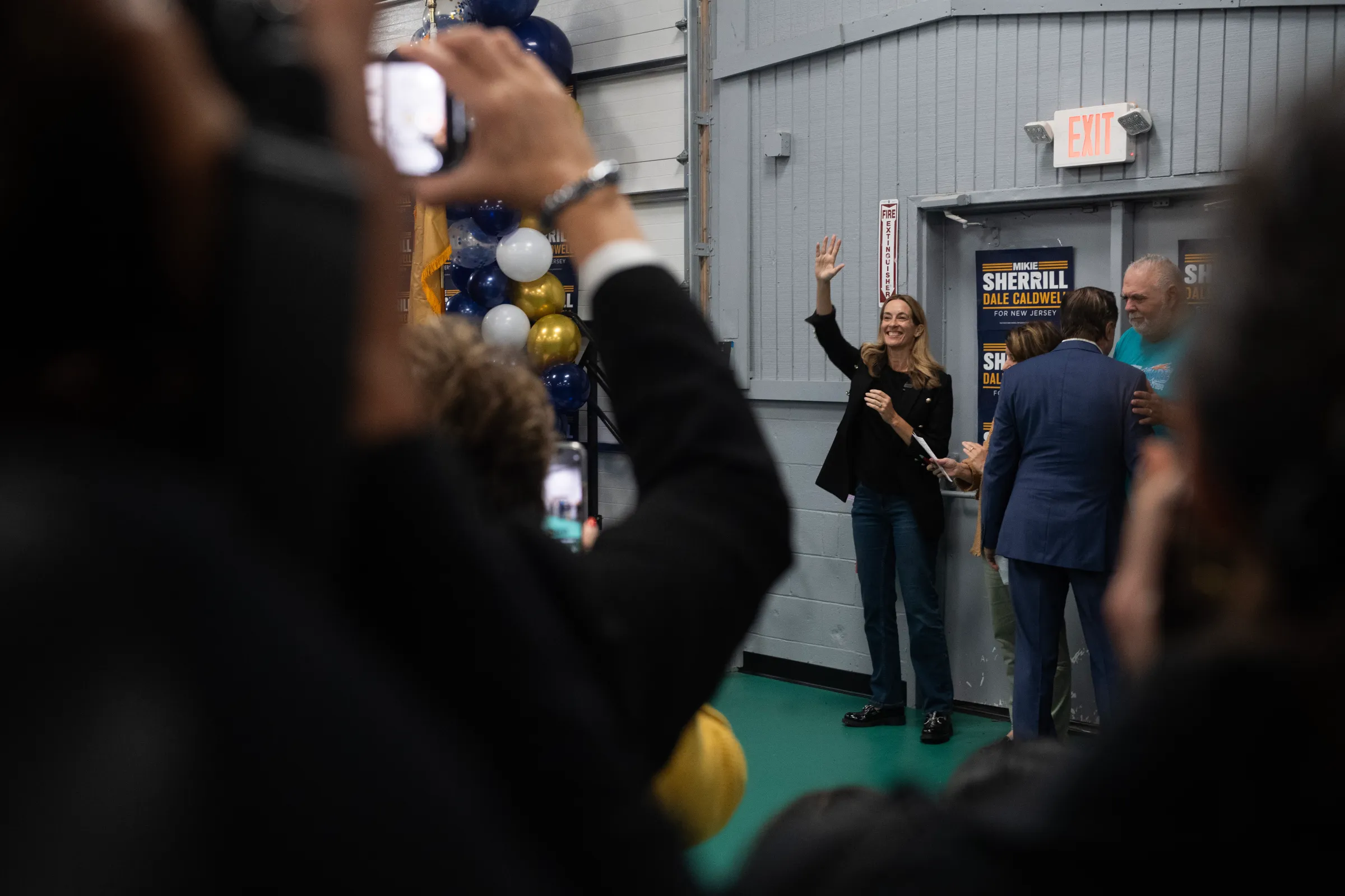 Sherrill waves to supporters