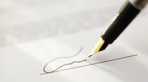 Getty Images Close up of a fountain pen scribbling on a piece of paper 