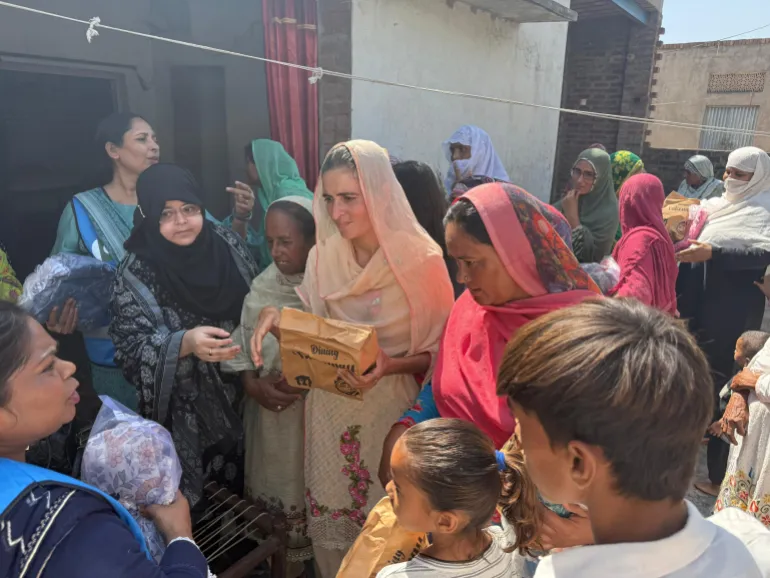 Activists of Mahwari Justice, a menstrual rights group, distributing period kits to women in Pakistan [Photo courtesy Mahwari Justice]